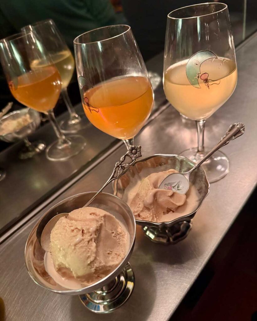 Two glasses of orange and white natural wine paired with ice cream at Goodbye Horses.
